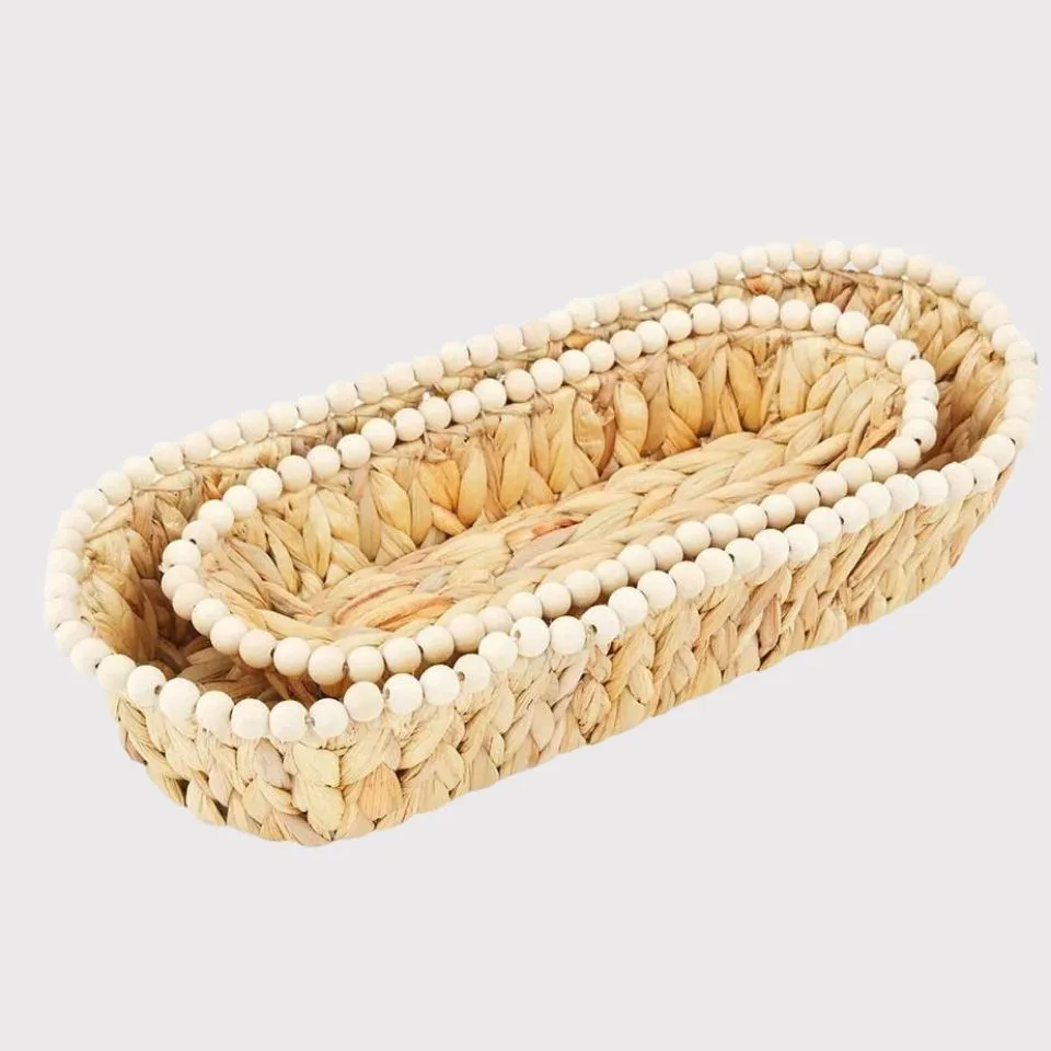 Water hyacinth bread baskets with decorative wooden bead rims, eco-friendly design.