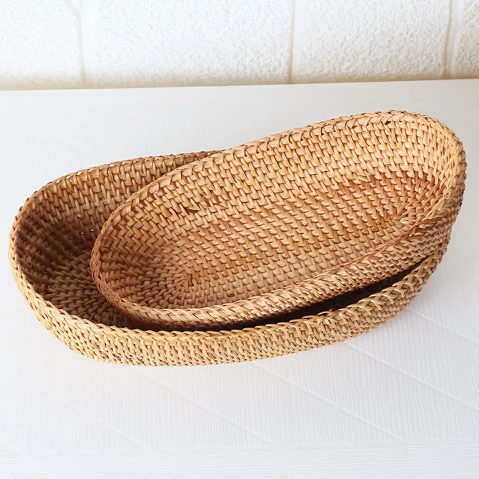 Oval rattan bread baskets with tight weave and natural finish.