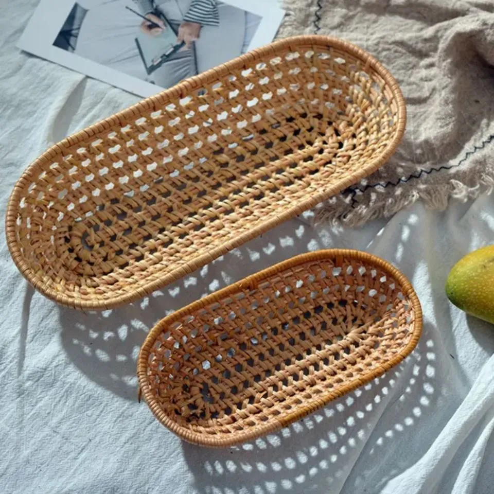 Handwoven rattan bread baskets in natural finish, oval shape with intricate open-weave pattern – wholesale kitchenware by EHM, Vietnam's trusted handicraft manufacturer.