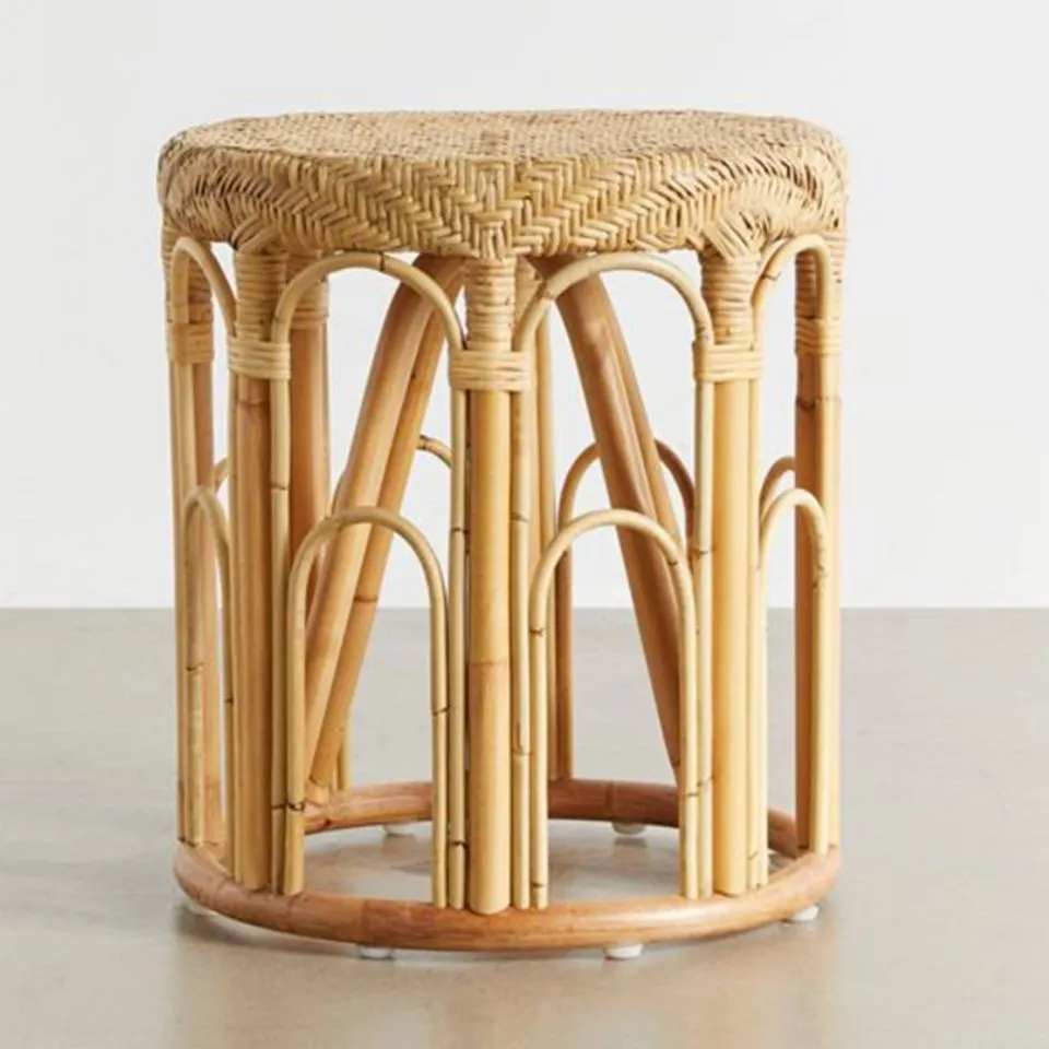 Artisan rattan side table with decorative arched vertical supports and woven top – ethical furniture manufacturing by EHM