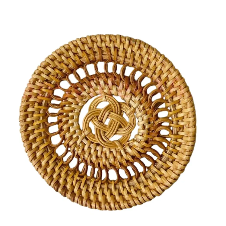 Rattan coaster with concentric spiral and sunburst weave.