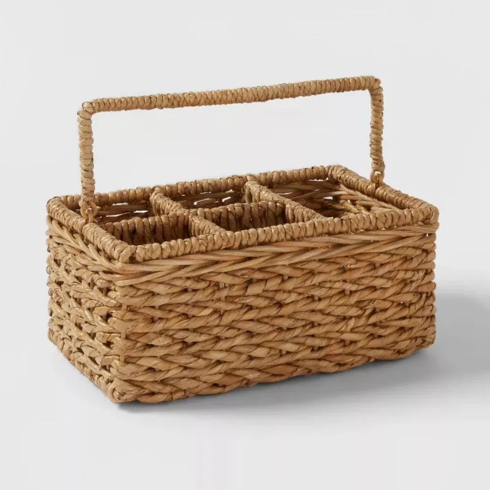 Handwoven seagrass flatware caddy with sturdy handle, ideal for custom manufacturing of eco-friendly kitchen organizers.