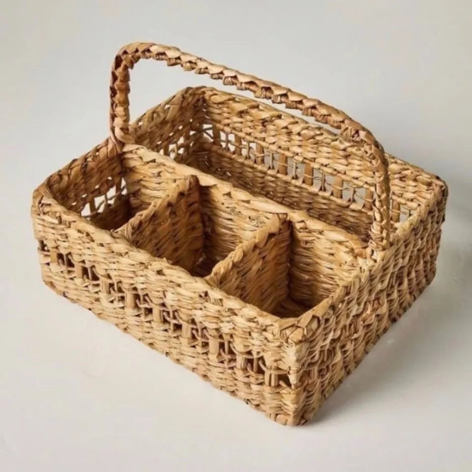 Side profile of a rectangular Water Hyacinth flatware caddy with intricate weaving and multiple slots, demonstrating precision in custom Water Hyacinth product manufacturing.