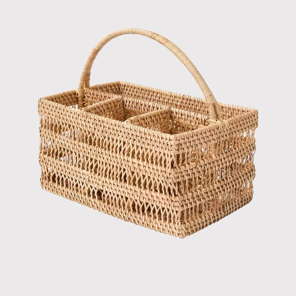Rattan flatware caddy with a braided handle, exemplifying innovative custom manufacturing for compact, stylish utensil storage solutions.