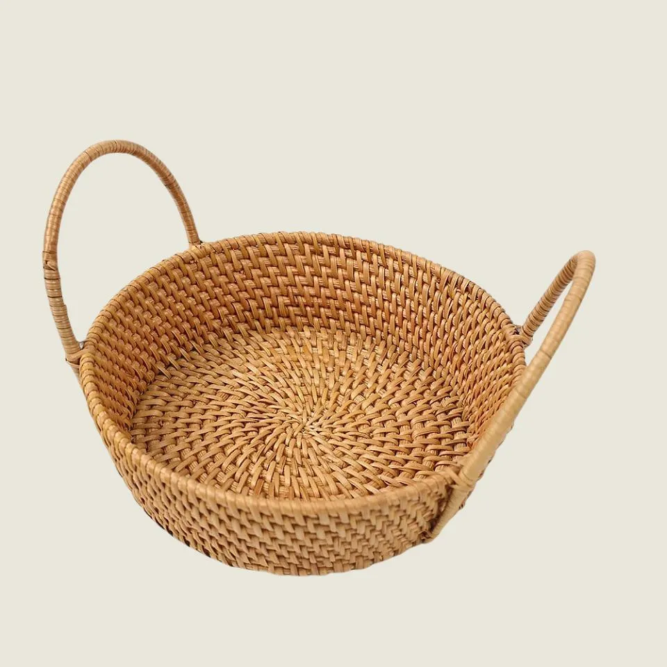 Handwoven rattan serving bowl with double handles – luxury tropical style for hotels and restaurants