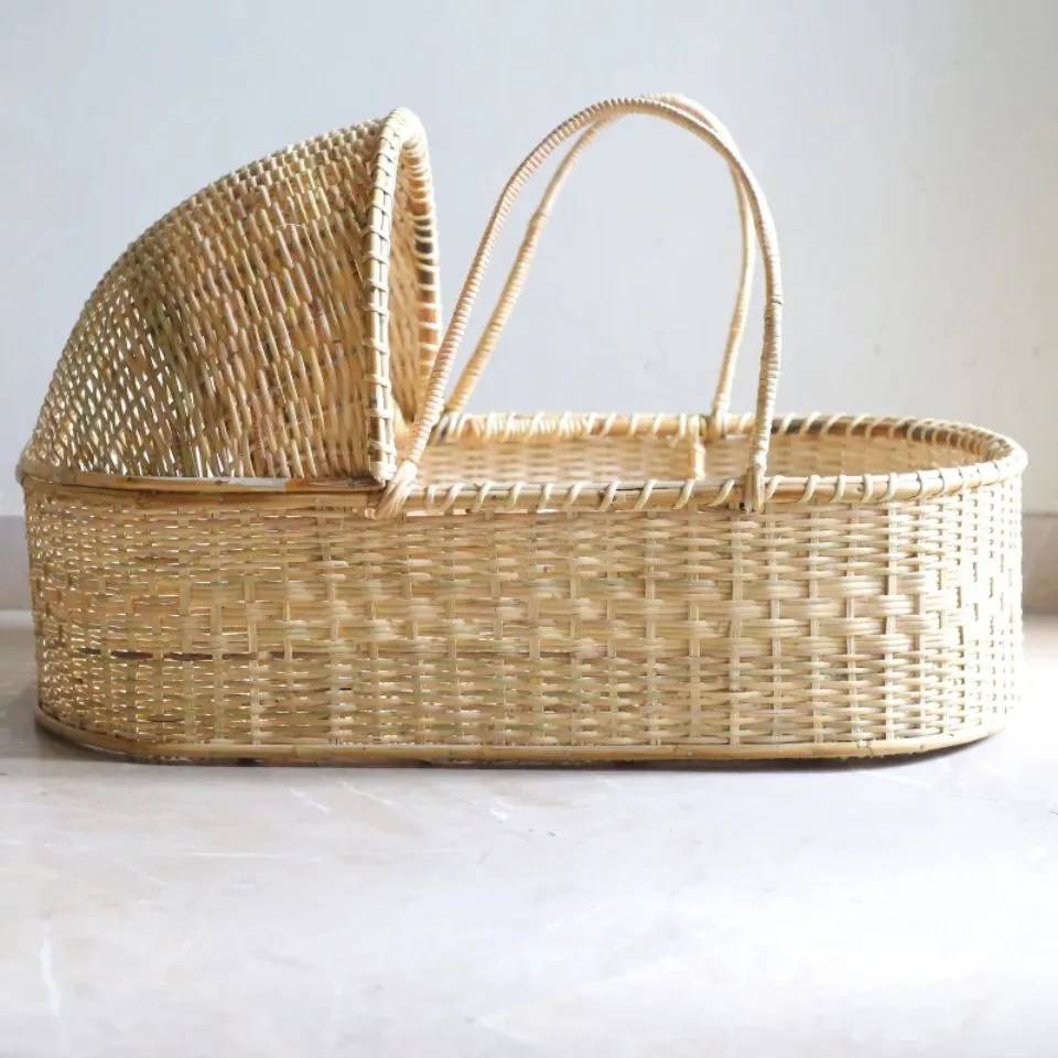 Handcrafted natural rattan Kid Basket with canopy and sturdy handles, ideal for OEM kid basket manufacturing.
