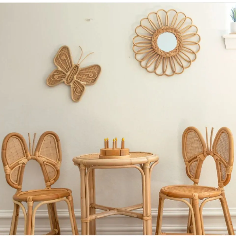 Kids’ rattan butterfly chair and round table set – handmade nursery furniture by EHM Vietnam.