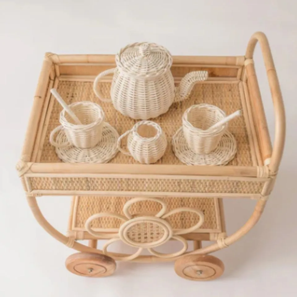 Mini handwoven rattan tea cart with teapot, cups, and saucers – pretend play kitchen toy for kids, crafted by EHM Vietnam.
