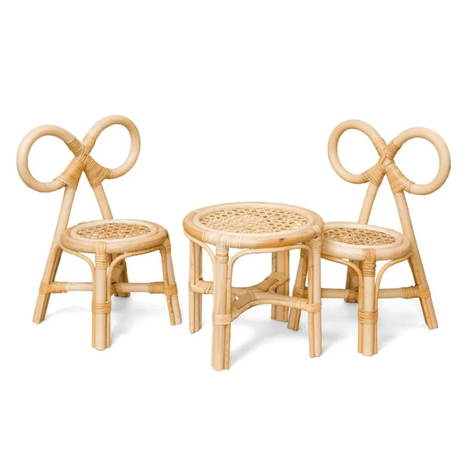 Adorable rattan kids table and bow chair set – handcrafted from premium natural rattan for tea parties and crafts.