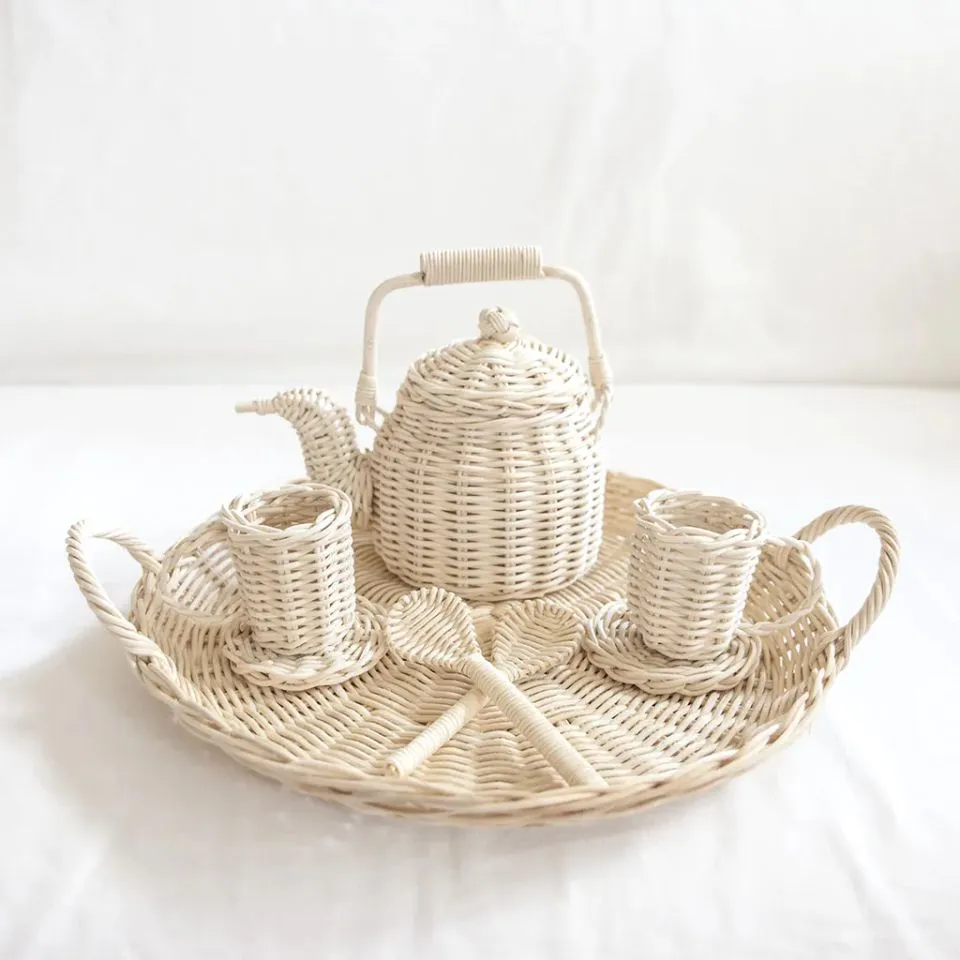 Handwoven rattan tea party set on oval tray – teapot, two cups, spoons, and saucers – perfect educational toy for kids