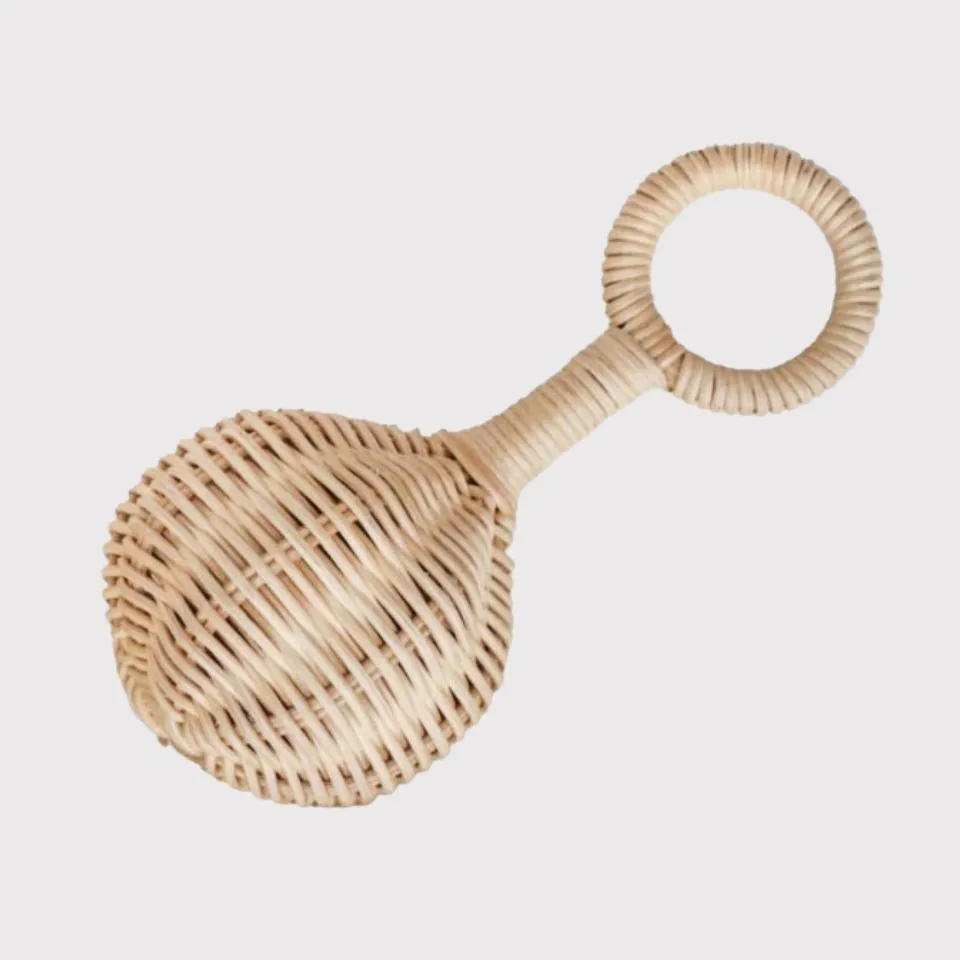 Handwoven rattan baby rattle with round handle and egg-shaped shaker – safe sensory toy for infants.