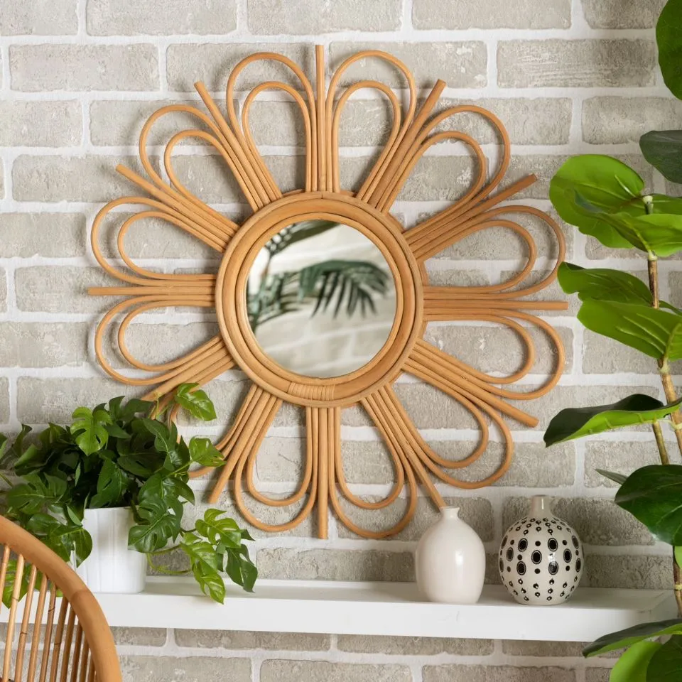 Handcrafted rattan sunburst mirror with intricate petal loops, sustainable home decor wall accent for boho-chic interiors, manufactured by EHM Vietnam.