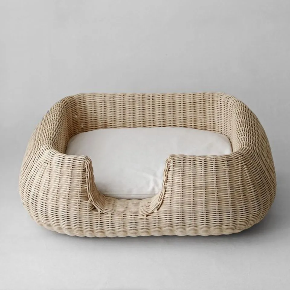 Fully handwoven rattan oval pet bed, premium sustainable pet house manufacturing.