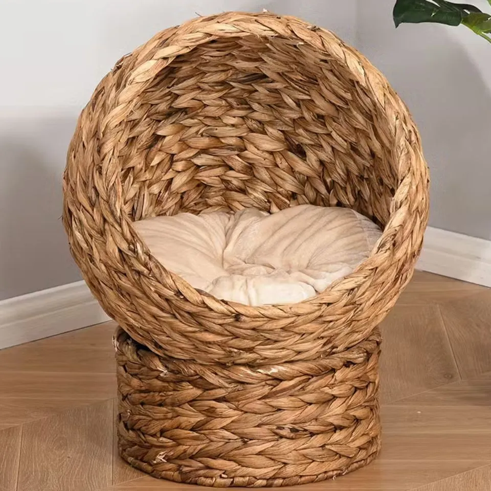 Eco-friendly water hyacinth woven cat cave with cushioned interior, sustainable pet house manufacturing.