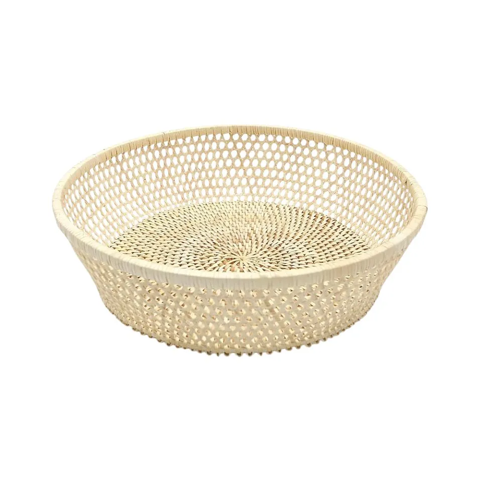 Large light-colored handwoven rattan bowl featuring intricate honeycomb open-weave pattern