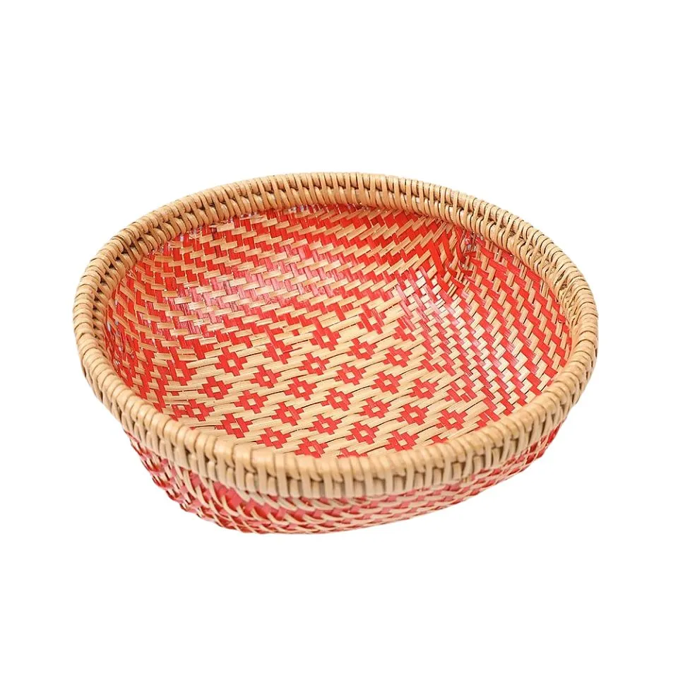 Vibrant red handwoven rattan and bamboo bowl with geometric floral motifs – ethical manufacturer EHM