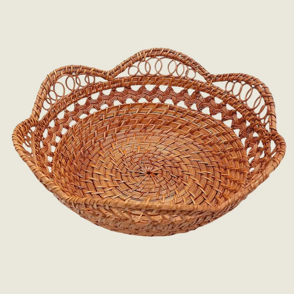 Luxury handwoven rattan bowl with elaborate scalloped lace rim and decorative loops – high-end manufacturer