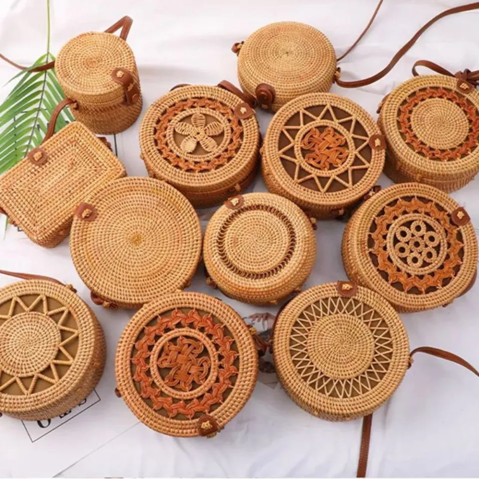 Handwoven rattan round crossbody bags with intricate floral patterns, boho fashion handcrafts by EHM