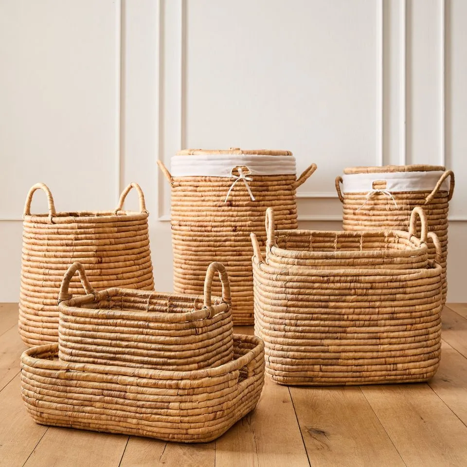 Natural seagrass laundry and storage baskets with handles and cotton liners in various sizes for rustic home decor