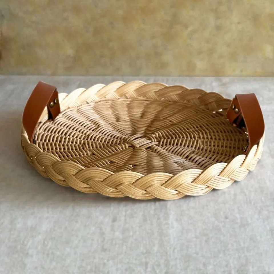 Eco-friendly rattan serving tray with sturdy handles, handmade from sustainable materials by EHM for ethical handicraft manufacturing.