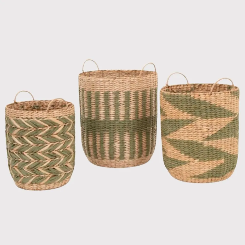 Three green and natural seagrass storage baskets with modern weave patterns and handles
