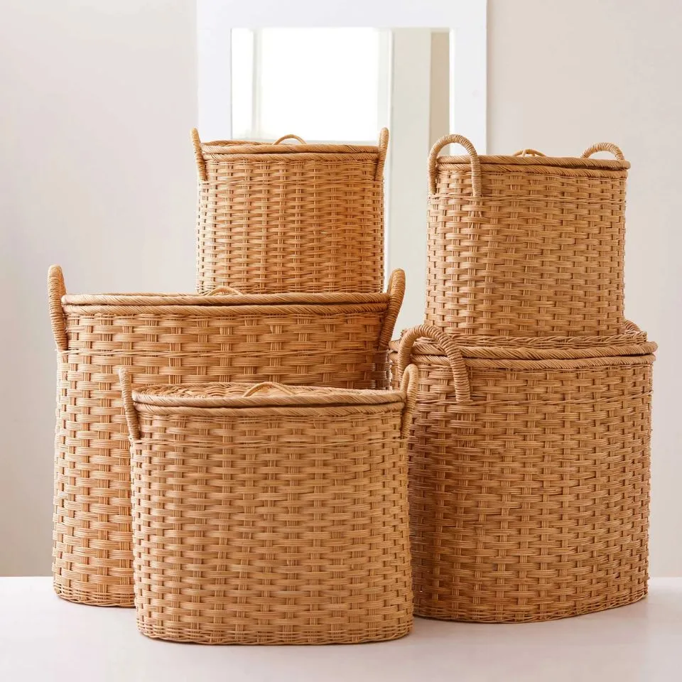 Oval rattan storage baskets with lids and handles – premium handmade hampers by EHM Vietnam.