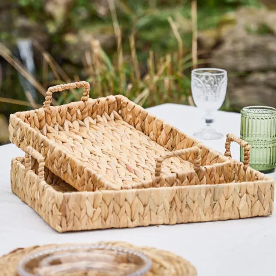 Eco-friendly water hyacinth woven trays with braided handles, rectangular rustic design, natural fiber texture – sustainable water hyacinth tray manufacturing