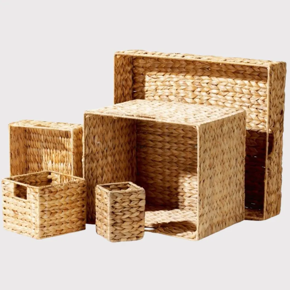Stackable rectangular and square water hyacinth storage boxes in graduated sizes – minimalist handmade organizers for home and office.